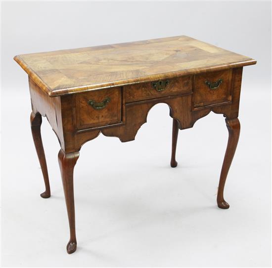 An early 18th century walnut lowboy, W.2ft 9in. D.1ft 9in. H.2ft 3in.